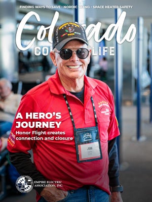Colorado Country Life November 2025 cover: US veteran in ball cap preparing to go on his honor flight